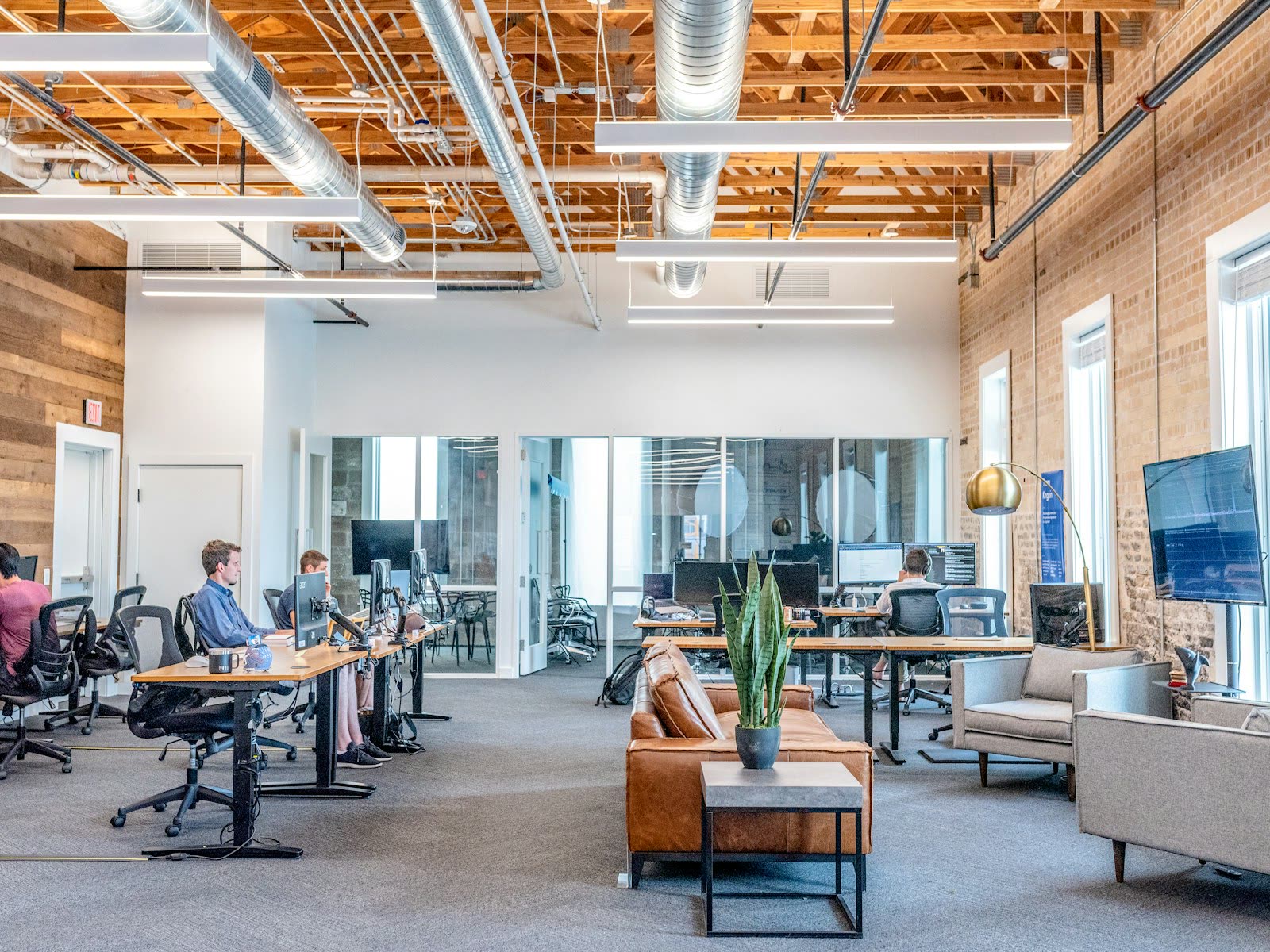 A modern open-plan workspace where senior practitioners deliver engagements