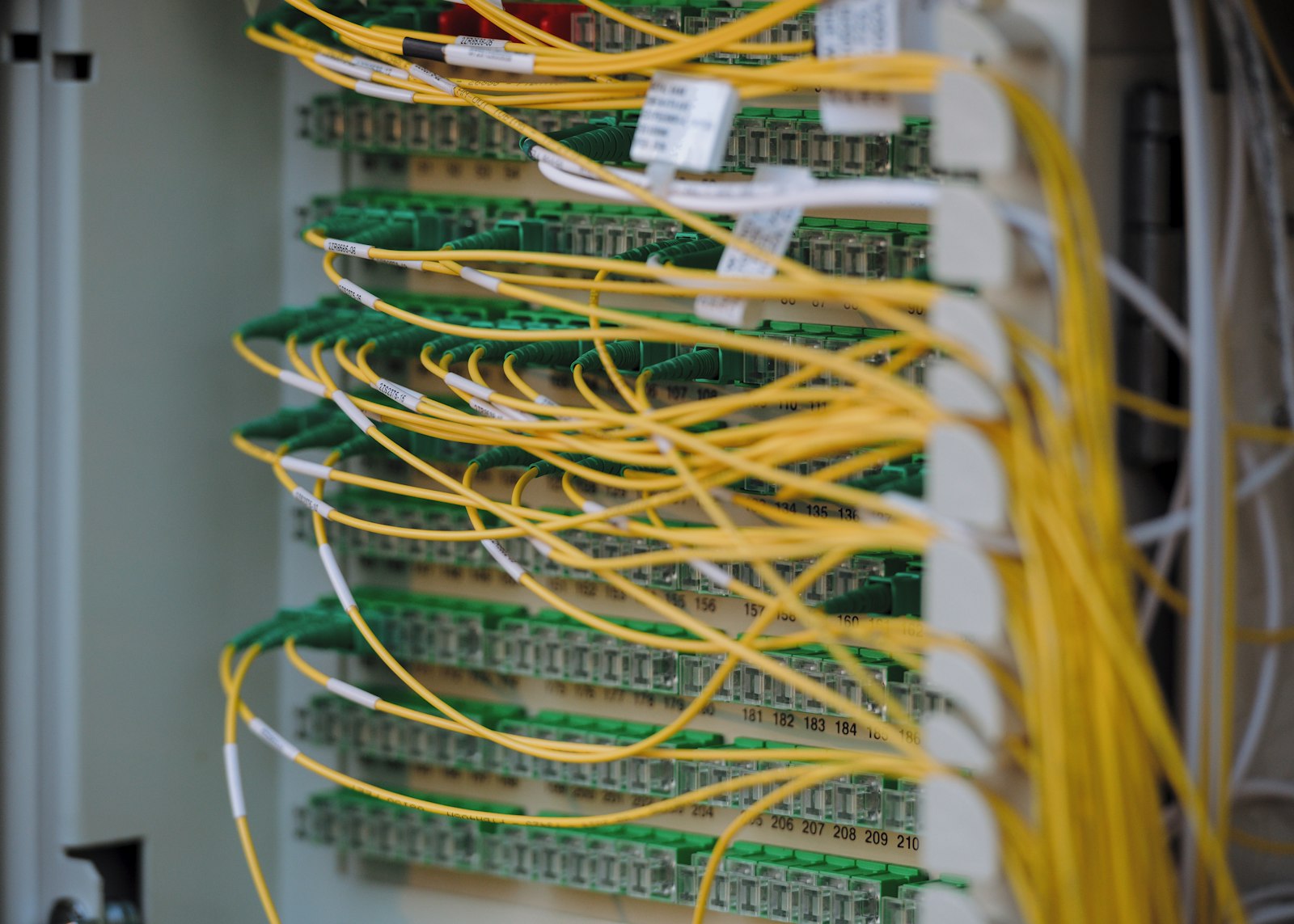 Structured fiber and network cabling in a hardened infrastructure rack