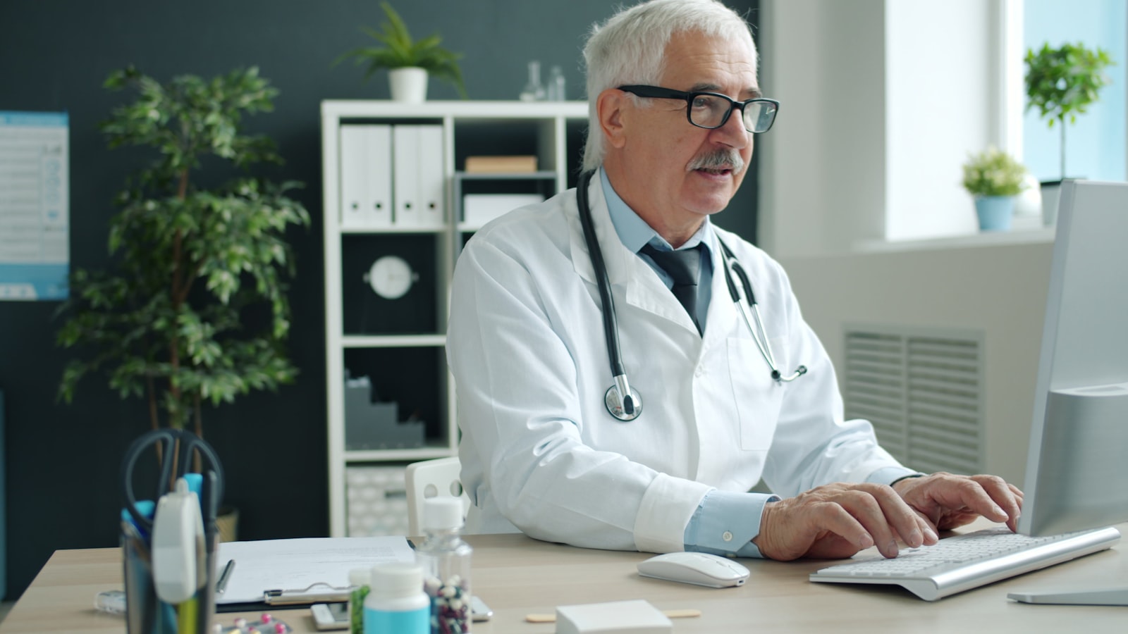 A clinician charting in an electronic health record system